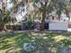 Charming home featuring a two-story design, a well-manicured lawn, and a striking red double-door entrance at 215 Nob Hill Cir, Longwood, FL 32779
