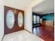 Welcoming foyer with double doors, tile flooring, and views into the living area at 215 Nob Hill Cir, Longwood, FL 32779