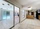 Eat in kitchen with tile flooring and sliding glass doors to sun room at 215 Nob Hill Cir, Longwood, FL 32779
