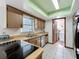 Modern kitchen with stainless steel appliances and view into laundry room at 215 Nob Hill Cir, Longwood, FL 32779