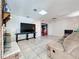 Living room featuring tile flooring, brick fireplace, and comfortable seating perfect for relaxing and watching TV at 215 Nob Hill Cir, Longwood, FL 32779