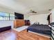 Main bedroom with ceiling fan and hardwood floors at 215 Nob Hill Cir, Longwood, FL 32779