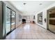 Sun room with tile floor and sliding glass doors to the backyard at 215 Nob Hill Cir, Longwood, FL 32779