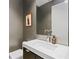Contemporary half bathroom with modern faucet, sleek fixtures, and minimalist gray paint for a luxurious touch at 229 Alexander Pl, Winter Park, FL 32789