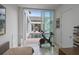 Bright room featuring sliding glass doors with a pool view, exercise bike, and modern decor at 229 Alexander Pl, Winter Park, FL 32789