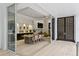 Elegant dining room with an open floor plan that features a natural wood table and views of the living room at 229 Alexander Pl, Winter Park, FL 32789