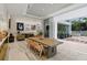 Dining room with an open floor plan that features a natural wood table and views of the backyard at 229 Alexander Pl, Winter Park, FL 32789