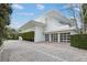 Stunning modern home featuring a clean white exterior and ample parking space at 229 Alexander Pl, Winter Park, FL 32789