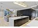 This modern kitchen is equipped with stainless appliances, a large island, and lots of cabinets at 229 Alexander Pl, Winter Park, FL 32789