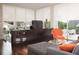 Bright living room with large windows and sleek modern furnishings at 229 Alexander Pl, Winter Park, FL 32789