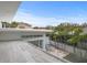 Outdoor patio with palm tree views, a built-in grill, and glass railing at 229 Alexander Pl, Winter Park, FL 32789