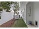 Backyard featuring an outdoor shower, artificial grass, and a privacy fence at 229 Alexander Pl, Winter Park, FL 32789