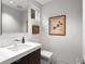 This modern powder room features contemporary fixtures and decor at 229 Alexander Pl, Winter Park, FL 32789