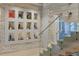 Modern staircase with a glass railing next to a modern display niche at 229 Alexander Pl, Winter Park, FL 32789