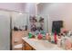 Small bathroom featuring vanity, sink, mirror, shower, and toilet at 25221 Quail Croft Pl, Leesburg, FL 34748