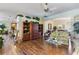 Spacious living room with hardwood floors, open floor plan, and abundant natural light at 25221 Quail Croft Pl, Leesburg, FL 34748