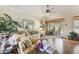 Cozy living room with patio access and lots of natural light at 25221 Quail Croft Pl, Leesburg, FL 34748
