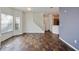 Bright living room with tile floors, staircase, and view of the open-concept kitchen at 2604 Grand Central Pkwy # 12, Orlando, FL 32839