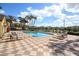 Beautiful community pool with lots of seating and lush landscaping at 2604 Grand Central Pkwy # 12, Orlando, FL 32839