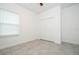 Bright bedroom with large window, tile floor, and double door closet at 2765 Sw 140Th Pl, Ocala, FL 34473