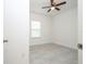 Bedroom view through door, showing tile flooring and a ceiling fan at 2765 Sw 140Th Pl, Ocala, FL 34473