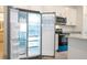 Bright kitchen featuring stainless steel appliances, granite countertops, and white cabinetry at 2765 Sw 140Th Pl, Ocala, FL 34473