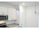Kitchen featuring pendant lighting, stainless steel appliances, granite countertops, and white cabinetry at 2765 Sw 140Th Pl, Ocala, FL 34473