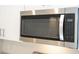 New stainless steel microwave with white cabinets at 2765 Sw 140Th Pl, Ocala, FL 34473