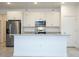 Bright kitchen island with granite countertops, stainless steel appliances, and pendant lighting above at 2765 Sw 140Th Pl, Ocala, FL 34473