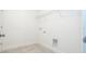 Laundry room with wire shelf and hookups for a washer and dryer at 2765 Sw 140Th Pl, Ocala, FL 34473
