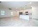Open-concept living space featuring modern finishes, ample natural light, and a view of the kitchen at 2765 Sw 140Th Pl, Ocala, FL 34473