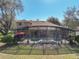 Aerial shot of the backyard features a screened-in pool area, lush landscaping, and a spacious lawn for outdoor enjoyment at 2805 Ponkan Meadow Dr, Apopka, FL 32712