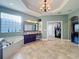 Bathroom boasts tile floors, garden tub, vanity area, and walk-in closet for convenient storage at 2805 Ponkan Meadow Dr, Apopka, FL 32712