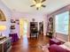 Bedroom with hardwood floors, large ceilings fan, and large desk. Perfect for working from home at 2805 Ponkan Meadow Dr, Apopka, FL 32712