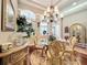 Formal dining room with elegant chandelier, hardwood floors, and stylish furnishings for sophisticated dining at 2805 Ponkan Meadow Dr, Apopka, FL 32712