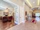 Spacious foyer leads to office with French doors and features elegant tile flooring, and decorative accents at 2805 Ponkan Meadow Dr, Apopka, FL 32712