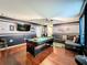 Entertaining game room showcasing a pool table, mounted TV, leather sofa, and hardwood floors at 2805 Ponkan Meadow Dr, Apopka, FL 32712