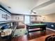 Game room with a billiards table, leather sofa, and Cowboys-themed decor at 2805 Ponkan Meadow Dr, Apopka, FL 32712