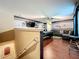 Spacious game room with a pool table, leather sofa, hardwood floors, and a ceiling fan at 2805 Ponkan Meadow Dr, Apopka, FL 32712