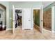 Hallway area showing the entrance to a walk-in closet, a toilet room, and shower stall at 2805 Ponkan Meadow Dr, Apopka, FL 32712