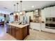 Gourmet kitchen with granite countertops, stainless steel appliances, and a center island at 2805 Ponkan Meadow Dr, Apopka, FL 32712
