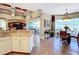 Open concept kitchen flowing into the dining area with large windows and access to the patio at 2805 Ponkan Meadow Dr, Apopka, FL 32712