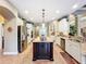 Open kitchen design featuring a large island with granite countertops and stainless steel appliances at 2805 Ponkan Meadow Dr, Apopka, FL 32712