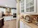 Bright kitchen with white cabinets, stainless appliances, and decorative counter accessories at 2805 Ponkan Meadow Dr, Apopka, FL 32712