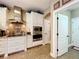 Well-equipped kitchen with stainless steel appliances and white cabinetry at 2805 Ponkan Meadow Dr, Apopka, FL 32712