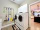 Convenient laundry room with washer, dryer, and extra storage cabinets at 2805 Ponkan Meadow Dr, Apopka, FL 32712