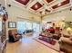 Inviting living room with high ceilings, backyard views, and comfortable seating for relaxation and entertainment at 2805 Ponkan Meadow Dr, Apopka, FL 32712