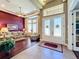 Elegant living room with tall windows, stylish furniture, and an open layout at 2805 Ponkan Meadow Dr, Apopka, FL 32712