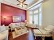Cozy living room with comfortable seating, hardwood floors, and a bright bay window at 2805 Ponkan Meadow Dr, Apopka, FL 32712