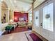 Elegant living room featuring hardwood floors, coffered ceilings, and sophisticated decor at 2805 Ponkan Meadow Dr, Apopka, FL 32712